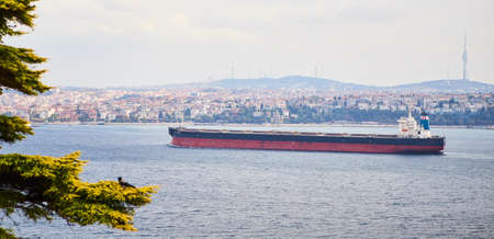ISTANBUL / TURKEY - OCTOBER 11, 2019: Cargo tanker in the Bosphorus. The strait connects the Black...