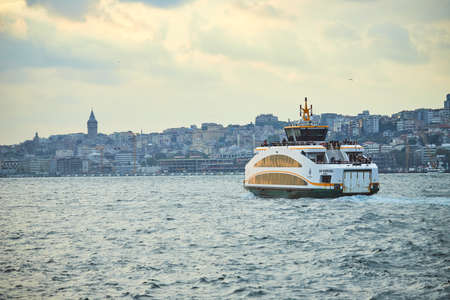 ISTANBUL / TURKEY - OCTOBER 11, 2019: 
Transport ferry in the Bosphorus. Ferryboat carries passengers from the Asian part (Anatolia) to the European part - Thrace.のeditorial素材