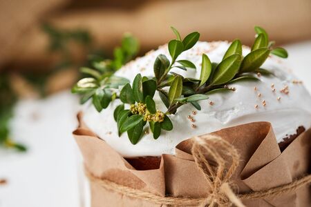 Glazed Easter cake on white wooden background, Traditional Kulich, Paska  ready for celebration