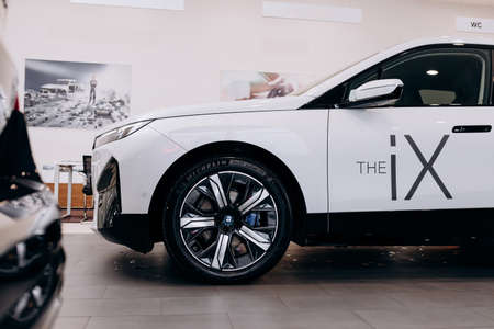 Vinnitsa, Ukraine - January 14, 2022. BMW IX - new model all-electric SUV car presentation in showroom - side viewのeditorial素材