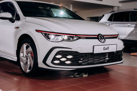 Vinnitsa, Ukraine - June 01, 2021.  Volkswagen Golf 8 GTI - new model car presentation in showroom - side viewのeditorial素材