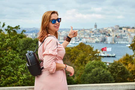 Happy young tourist woman visit ancient Istanbul Topkapi palace. Follow me to Istanbul, Turkey