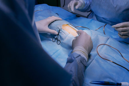 Veterinary surgeons make surgery for dog in the operating room of a veterinary clinic. Medicine,...