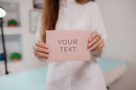 Girl holding a certificate card for servicesの写真素材