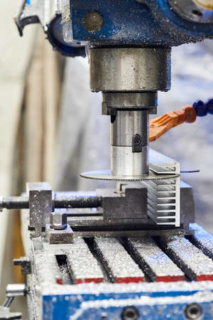 Cutting aluminium billet with machine.  Circular milling machine cutting metal profile.Steel...