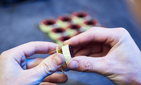 The master specialist makes electromagnetic coils for computer devicesのeditorial素材