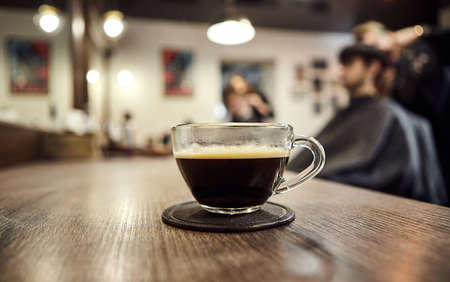 Cup of coffee in barbershop. Client serviceの写真素材