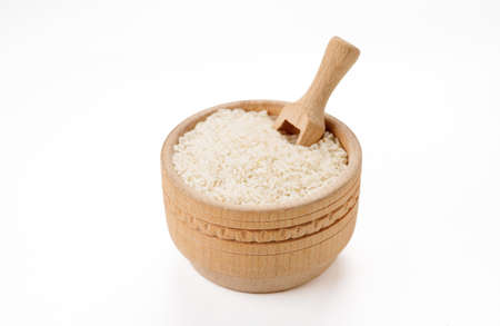 Long polished rice in bowls and bags isolated on a white background. High quality photoの写真素材