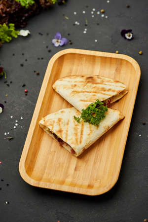Tasty snacks Tortilla with vegetables and meat. Photo for restaurant menu. Mexican Taco foodの写真素材