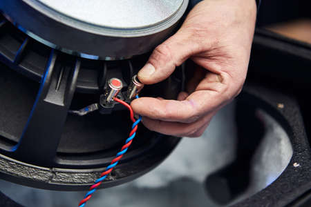 Worker is production speakers and loudspeakers at the factory. Handmade creation of acoustic music systemsの写真素材