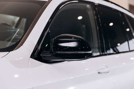 Vinnitsa, Ukraine - January 14, 2022. BMW IX 3- new model all-electric SUV car presentation in showroom - side mirrorのeditorial素材