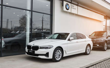 Vinnitsa, Ukraine - February 24, 2021. Side view of BMW Series 5 - new model car presentation in showroomのeditorial素材