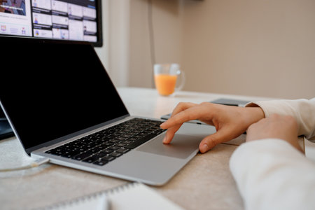 Woman designer working at home office on new ideas. Young happy female freelancer working on...