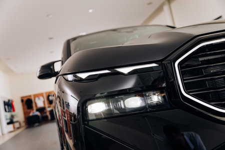 Vinnitsya, Ukraine - May 18, 2023 : BMW XM - Luxury car fully electric edrive technology in plug-in hybrid system presentation in showroom - headlightのeditorial素材