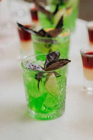 Welcome drink with cocktail glasses and drinks at an event. Alcoholic beverages at a weddingの写真素材