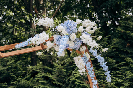 Close-up of a beautifully decorated floral wedding arch for an elegant outdoor ceremony