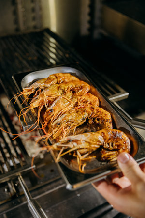 Grilled shrimp on serving tray, perfect for food menus, restaurant promotions, and seafood cuisineの写真素材