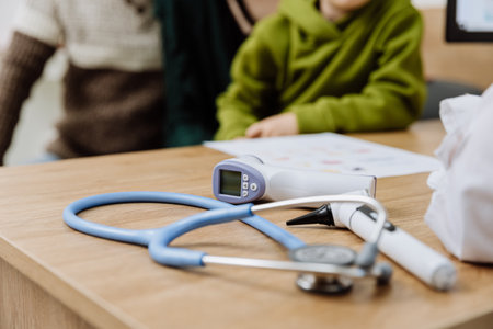 Medical equipment on a doctors desk, ready for pediatric examinationの写真素材