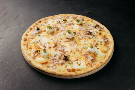 Classic Italian pizza with a golden cheese topping and herbs, ready to enjoyの写真素材