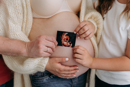 Family bonds grow stronger as they cherish the ultrasound of their soon-to-arrive baby