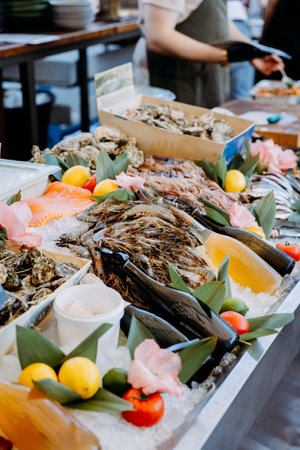 Luxury seafood buffet with fresh oysters, shrimp, and salmon, beautifully displayed on iceの写真素材