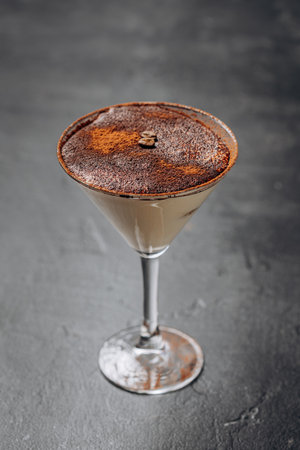 Elegant espresso martini with a dusting of cocoa and coffee beans, perfect for cocktail lovers