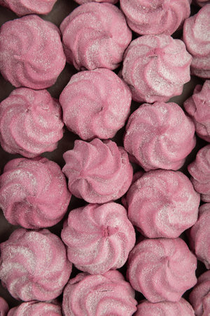 Pink homemade marshmallow candies in rows. Sweet dessert background, top view