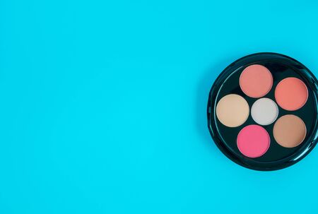 Beautiful cosmetics accessories on bright blue background.Beauty concept.の写真素材