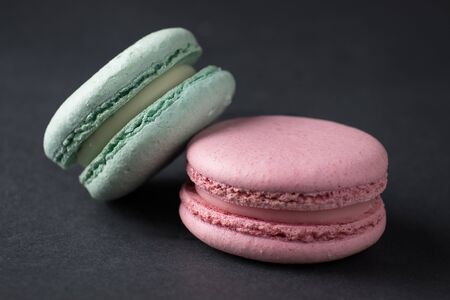 colored sweet macaroons closeup darkmoodyの写真素材