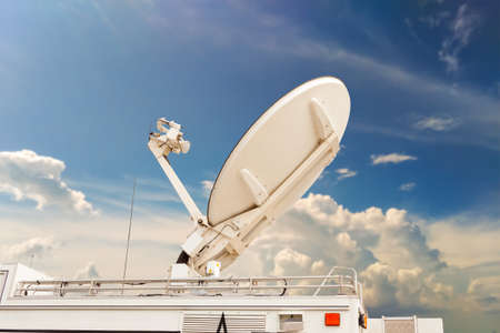 Satellite dish on Car transmitter send a signal.の写真素材