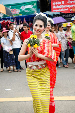 UBONRATCHATHANI,  THAILAND - JULY 23 : : Unidentified dancers perform traditional Thai-Esan dance. Traditional candle procession festival of Buddha. Local people and tourists happily celebrate together. July 23,2013  in Ubonratchathani, Thailand.のeditorial素材