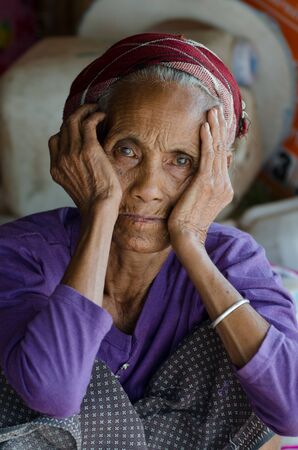 BAN NONGKHAM , VIANGPHOUKHA, LUANGNAMTHA , LAO P D R -  MAY 31     An unidentified khmu ethnic woman poses for the photo in her house by the R3A route on May 31 , 2013 at  Ban Nongkham,Viangphouka,Luangnamtha,Lao pdrのeditorial素材