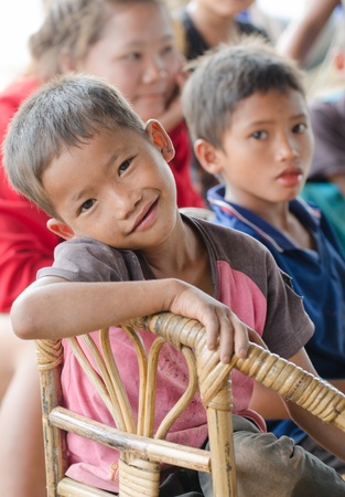 VIANGPHOUKHA, LUANGNAMTHA , LAO P D R  MAY 31   Unidentified Khmu ethnic boy  10 years old smiles for camera by  the R3A route on June 1, 2013 in Viangphoukha,Luangnamtha,Lao pdrのeditorial素材