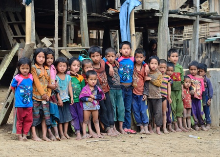 BAN  NAMLOW , VIANGPHOUKHA, LUANGNAMTHA , LAO P D R  MAY 31   Unidentified  group of  Akha  ethnic kids  7-12 years old smile to camera  on May 31,2013  at  Ban namlow, Viangphoukha,Luangnamtha,Lao pdrのeditorial素材