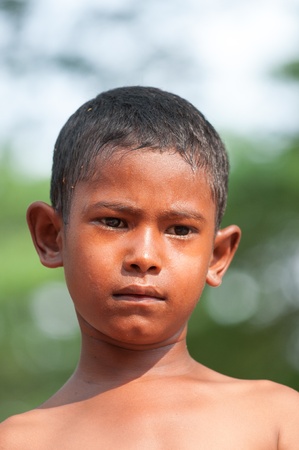 MAE SOT,TAK,THAILAND-APIRL14;Unidentified burmese child poses for photo at outdoor boxing ring near Mae sot international check point  Thailand-Myanmar border during Songkran festival on Apirl 14,2013,Mae sot,Tak,Thailandのeditorial素材