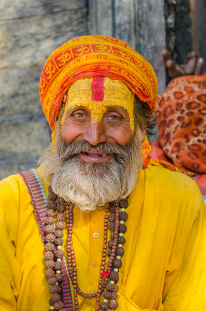 KATHMANDU, NEPAL - DECEMBER 04  Holy sadhu seeks alms in Pashupatinath Temple on December 04, 2013 in Kathmandu, Nepalのeditorial素材