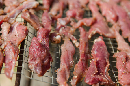 raw beef with spices drying in the sunの写真素材