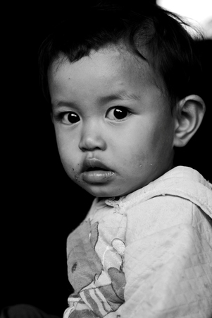 HUAY PHAKKOOD,MAE CHAEM,CHIANGMAI,THAILAND -JUNE 14   Unidentified Karen kid poses for camera on June 14,2014 at Huay Phakkood,Mae Chaem District, Chiang Mai,Thailandのeditorial素材