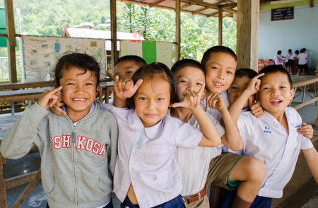 BAAN MAE- OR  , MAE CHAEM, CHIANGMAI, THAILAND, JUNE 10   Unidentified Karen ethnic kids  are showing  call me  sign at  their primary school   on June 10,2014 Mae chaem,Chiangmai,Thailand のeditorial素材