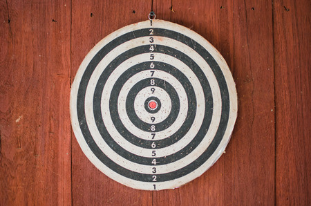 dart board on classical wood wallの写真素材