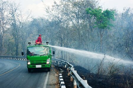 CHIANGMAI, THAILAND - MARCH 4: Fire Trucks on a road to prevent the wildfire cross the road, in...