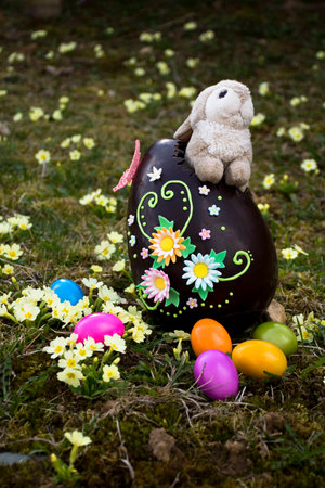 Easter egg decorated with sugar flowers, with plush bunny as a surprise.