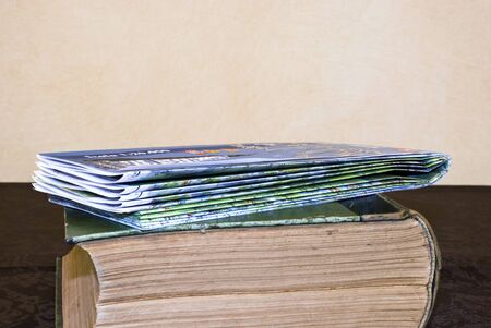 The road map folded over the old bookの写真素材