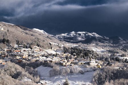 the small mountain village, covered with snowの写真素材