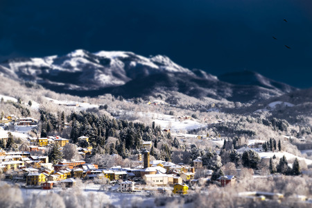 the small mountain village, covered with snowの写真素材