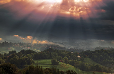 Sunbeams in the clouds above the village of Sordevolo