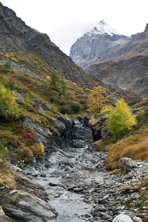 the torrent descends from the mountainの写真素材