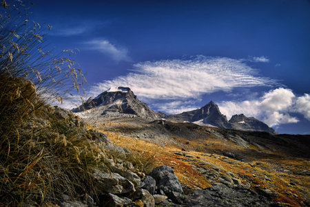 The Ciarforon, the Becca di Monciair and the Becchi della Tribolazione, seen from the path that climbs to the Vittorio Emanuele refuge in the Savaranche valley.の写真素材
