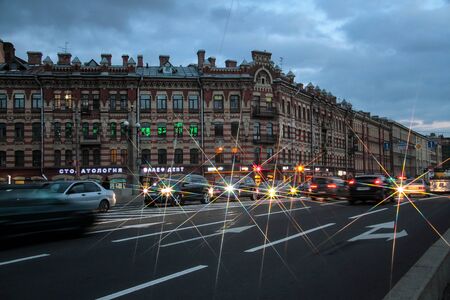 St. Petersburg, Russia, October 4, 2018. City streets against the background of bright light of lanterns in the autumn eveningのeditorial素材