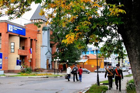Russia, Moscow region, September 15, 2016. Autumn cityscape in a small town on a background of autumn leaves.のeditorial素材